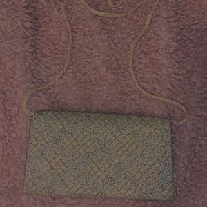 Gorgeous bedazzled purse! Silk lining and string strap!